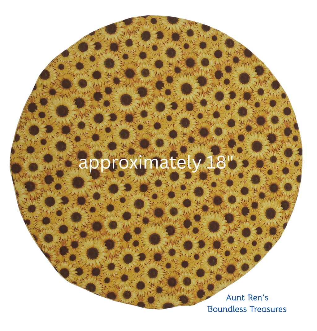 Round yellow fabric with brown sunflower pattern, size approximately 18