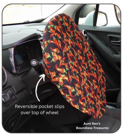 chili peppers on black fabric covering steering wheel with an arrow showing it can be reversible