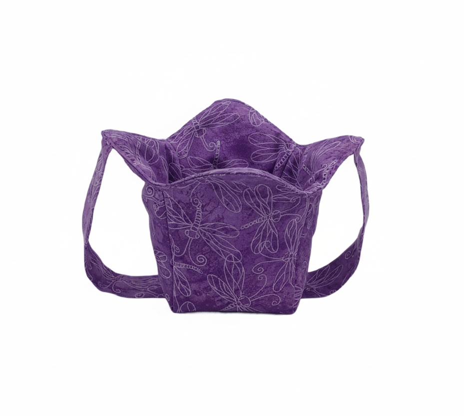 pint size cozy, purple fabric with white outline of dragonflies