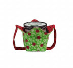 Ladybugs on green fabric with leaves on outside and red fabric with black polka dots on inside with a matching strap holding pint of ice cream