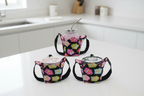 Set of three pint cozies holding different items: soup container, mason jar and ice cream with colorful owl pattern