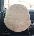Calico brown fabric cover slipped over steering wheel of a car