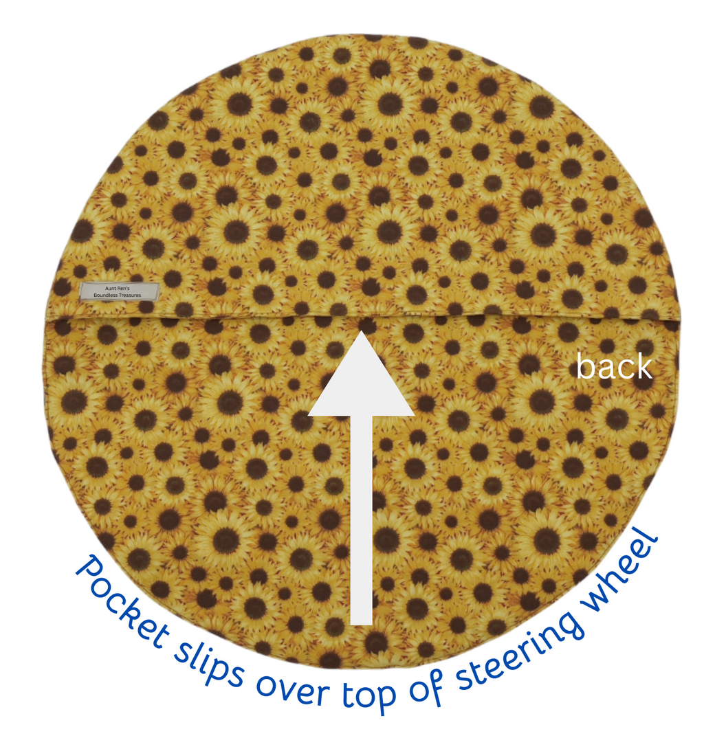 Patterned steering wheel cover with text indicating where to slip the pocket over the top.