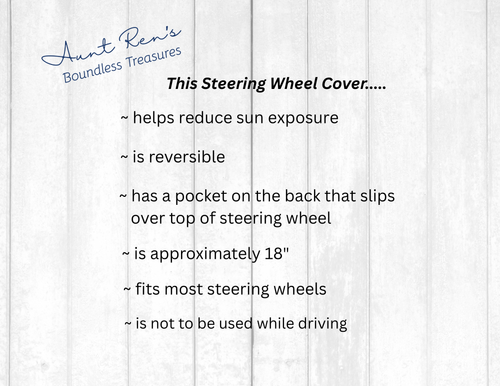 Text description of a steering wheel cover on a white wooden background with 'Aunt Ren's Boundless Treasures' branding.