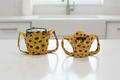 two sunflower ice cream cozies with handles for hand support