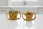 two sunflower ice cream cozies with handles for hand support