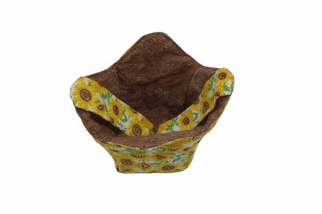 Sunflower pint cozy with brown leaf fabric showing, yellow sunflower print on reverse, carrying strap inside