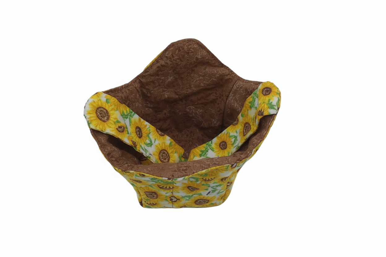 Sunflower pint cozy with brown leaf fabric showing, yellow sunflower print on reverse, carrying strap inside