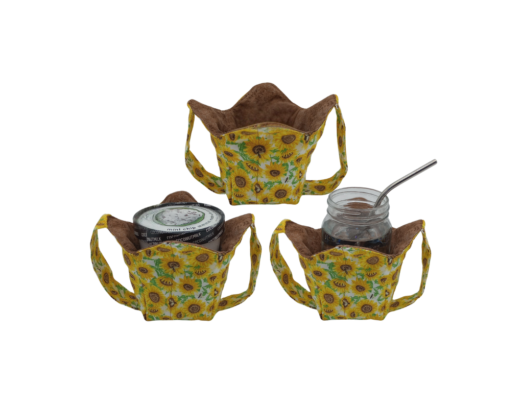 Three sunflower-patterned fabric holders with jars in one and pint of ice cream in another