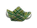 Green and white checkered fabric basket with white straps on a white background