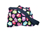 bowl cozy featuring colorful owls on black fabric with a black strap