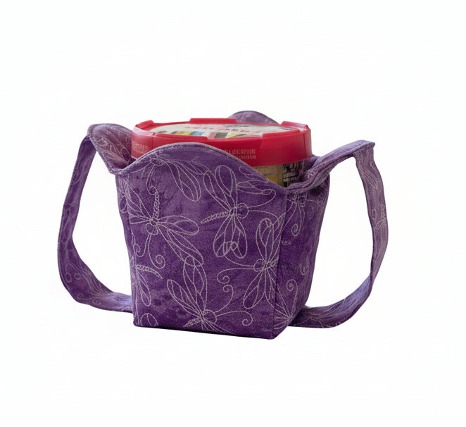 purple and white dragonfly cozy with handles holding a pint size container of ice cream
