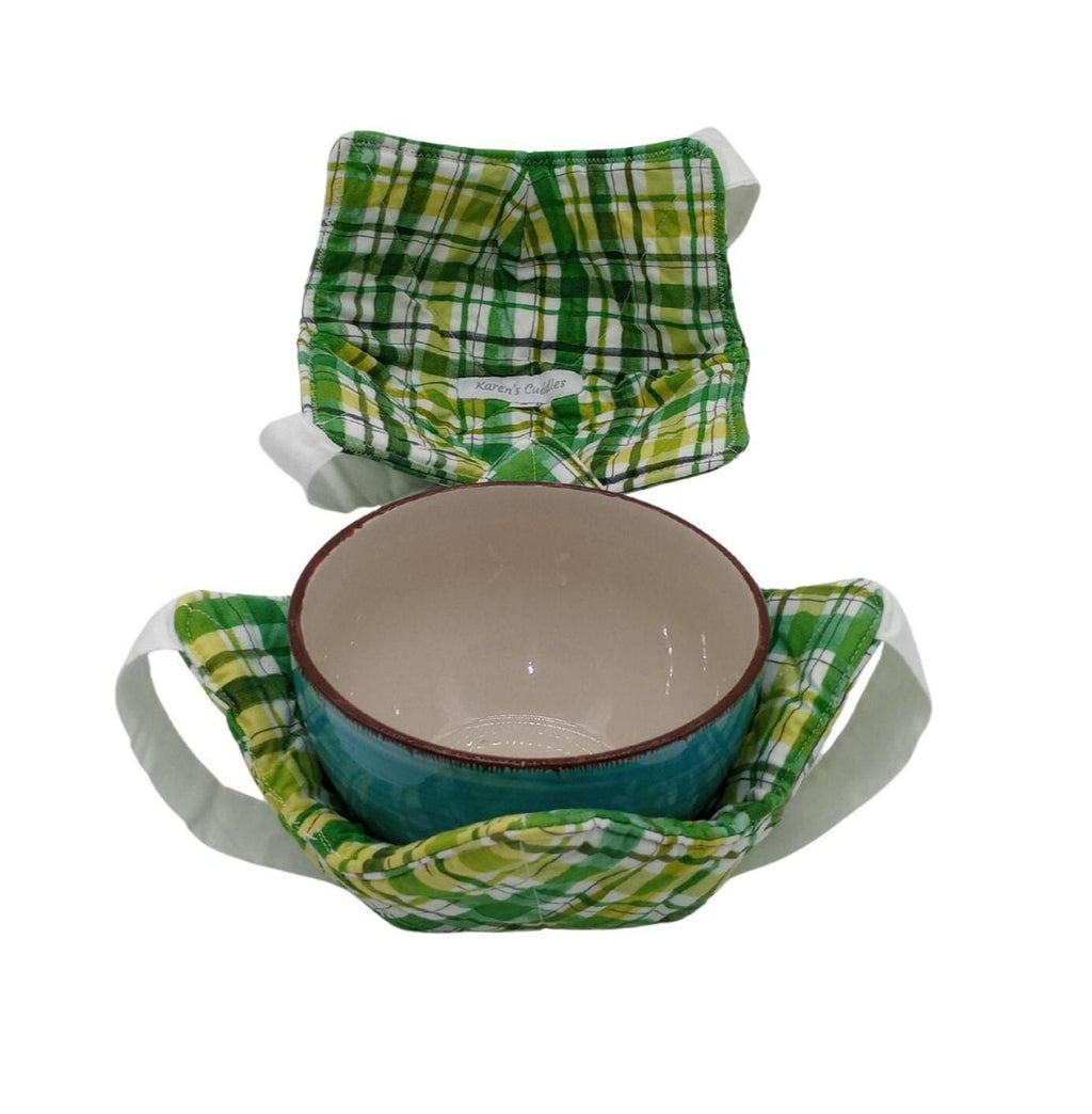 Ceramic bowl with a green plaid fabric cover on a white background