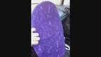 this video demonstrates how a purple steering wheel cover slips over the top of a car steering wheel. 