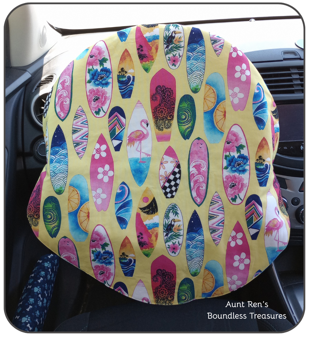 surfboards of different designs on yellow cotton fabric steering wheel cover